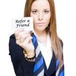 Woman Holding Refer a Friend Card